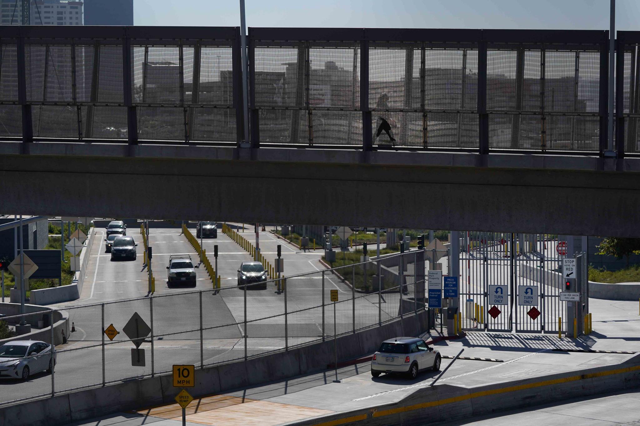 A few cars make their way north to cross into the United States from Tijuana, Mexico, Wednesday, Oct. 13, 2021, at the San Ysidro Port of Entry in San Diego.