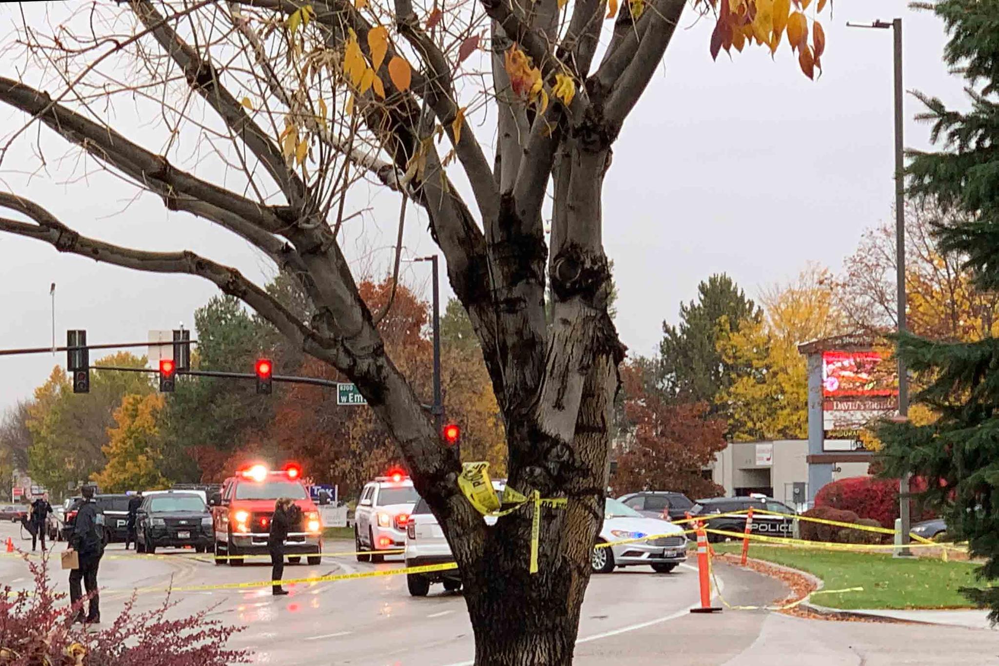 Police close off a street outside a shopping mall after a shooting in Boise, Idaho on Monday, Oct. 25, 2021. Police said there are reports of multiple injuries and one person is in custody.
