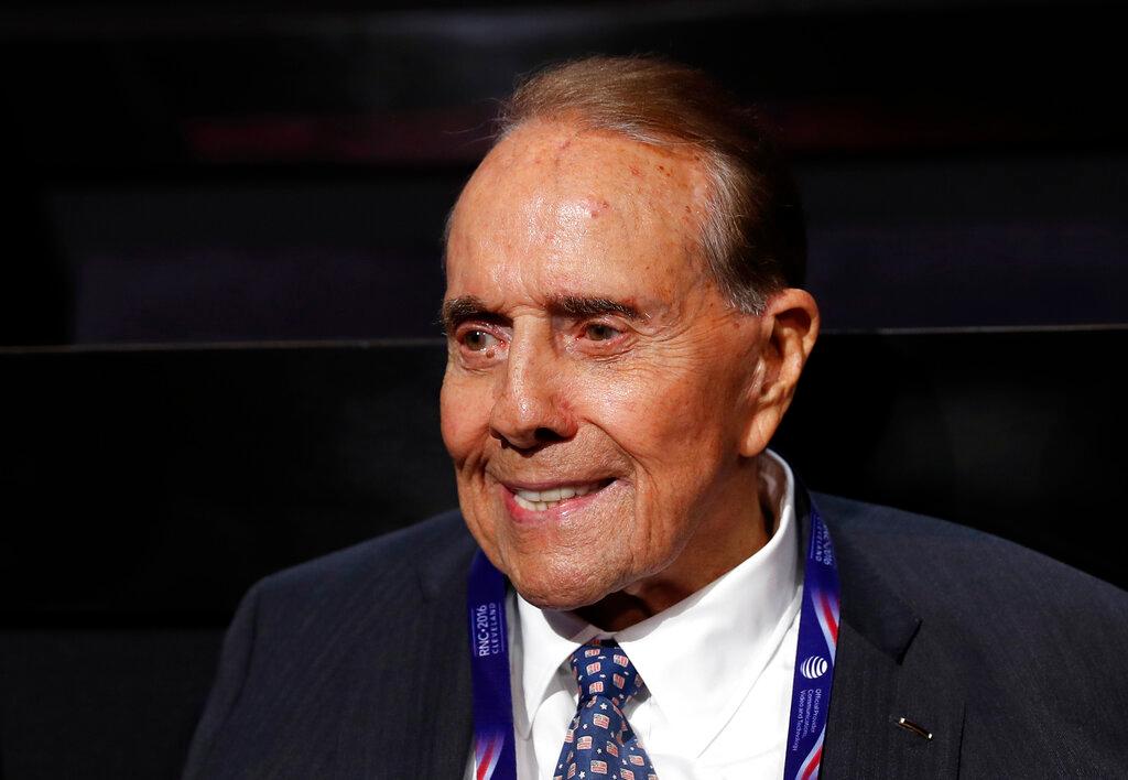 Former Republican presidential candidate Sen. Bob Dole arrives at the Quicken Loans Arena before the evening session of the opening day of the Republican National Convention in Cleveland, Monday, July 18, 2016. Bob Dole, who overcame disabling war wounds to become a sharp-tongued Senate leader from Kansas, a Republican presidential candidate and then a symbol and celebrant of his dwindling generation of World War II veterans, has died. He was 98. His wife, Elizabeth Dole, posted the announcement Sunday, Dec. 5, 2021, on Twitter.