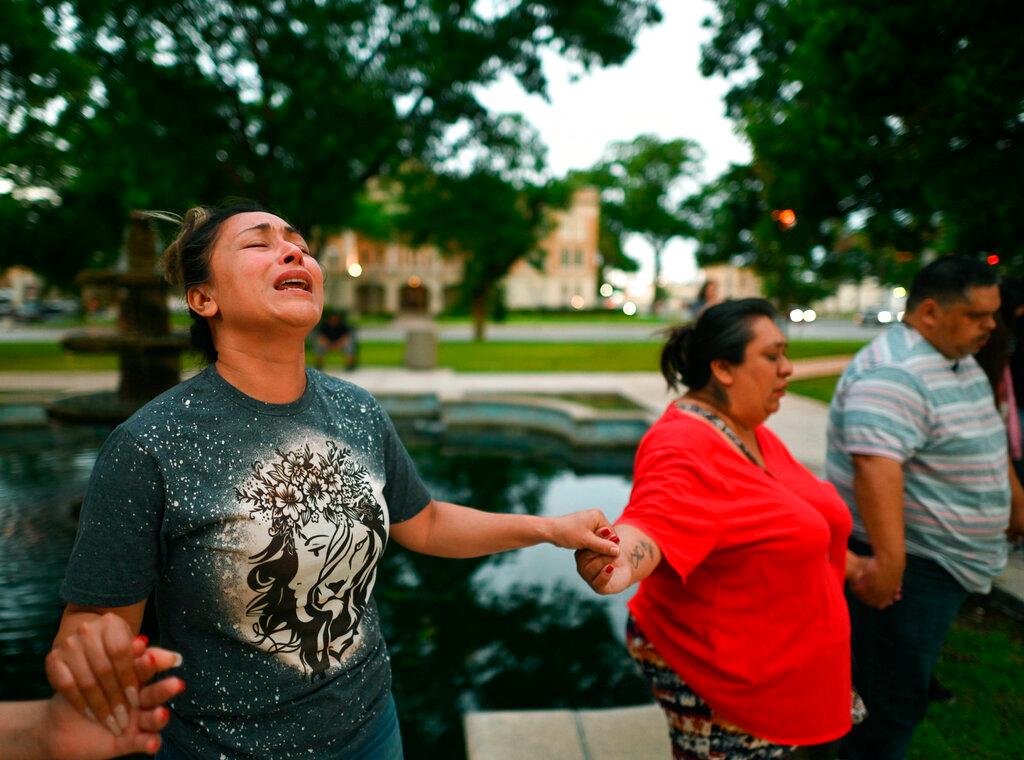 Kladys Castellón prays during a vigil for the victims of a shooting at Robb Elementary School in Uvalde, Texas, on Tuesday, May 24, 2022
