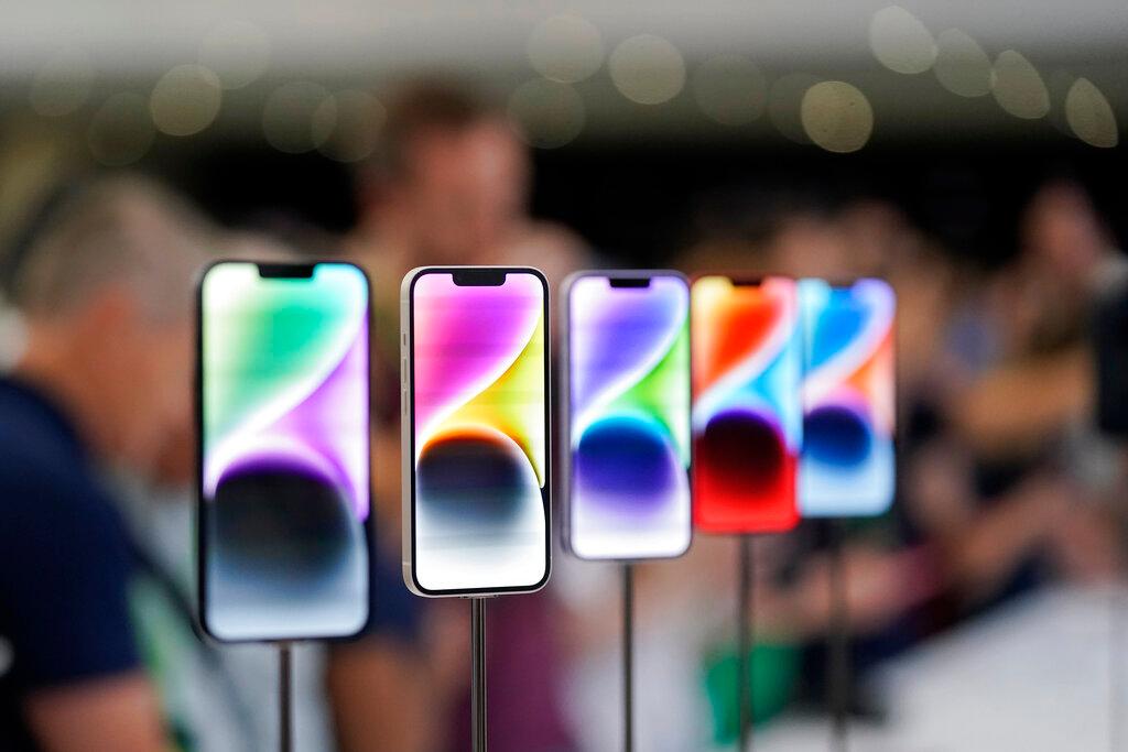 New iPhone 14 models on display at an Apple event on the campus of Apple's headquarters in Cupertino, Calif.