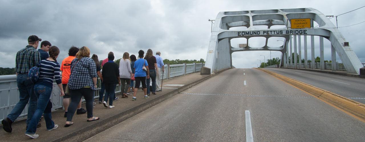 Dr. Murry Murdoch leads a group of Cedarville University students across the Edmund Pettus Bridge during Cedarville's last Civil Right Bus Tour in 2019