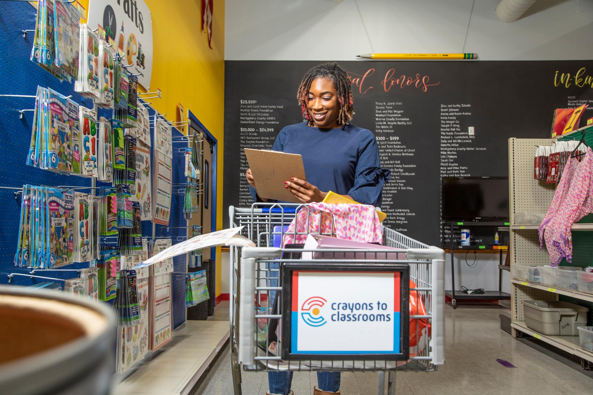 Teacher shopping for needed supplies at Crayons to Classrooms warehouse