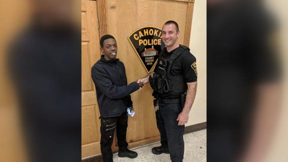 Ka’shawn Baldwin and Officer Roger Gemoules shake hands